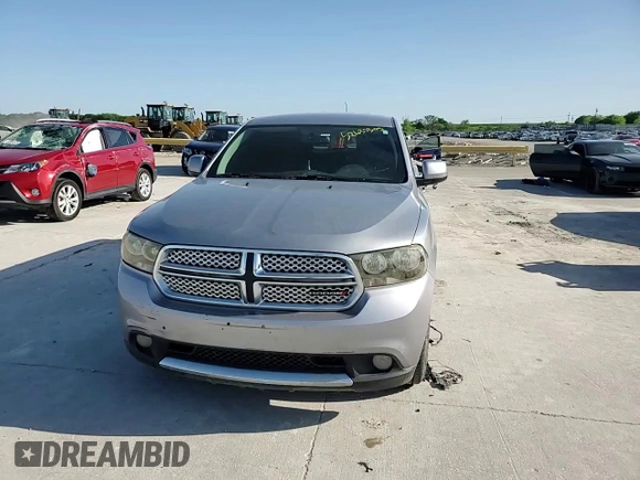 2013 Dodge Durango SXT z VIN 1C4RDHAGXDC697865, wystawiony jako Copart lot #52635305 z przebiegiem 206 980 mil mil oraz Czysty tytuł • Clean title. Historia ofert i sprzedaży dostępna na DreamBid. Obrazek 14.