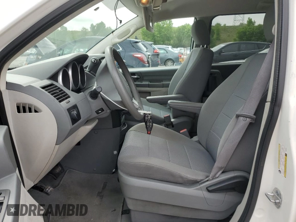 2009 Dodge Grand Caravan SE z VIN 2D8HN44EX9R533530, wystawiony jako Copart lot #59548375 z przebiegiem 130 956 mil mil oraz Szkoda całkowita • Salvage title. Historia ofert i sprzedaży dostępna na DreamBid. Obrazek 7.