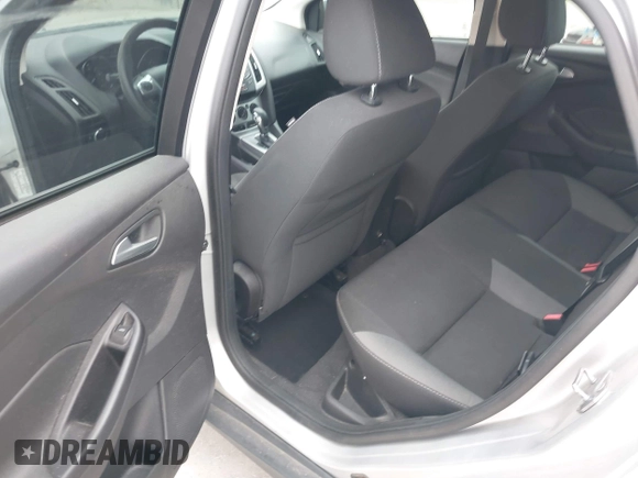 2013 Ford Focus SE z VIN 1FADP3F25DL189133, wystawiony jako IAAI lot #42438118 z przebiegiem 122 350 mil mil oraz . Historia ofert i sprzedaży dostępna na DreamBid. Obrazek 14.