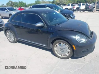 2013 Volkswagen Beetle 2.5L w/Sun/Sound/Nav with VIN 3VWJX7AT8DM647635, listed as a IAAI auction lot 41836828 with 124,112 mi miles and . Bid and sale history available at DreamBid. Image 1.