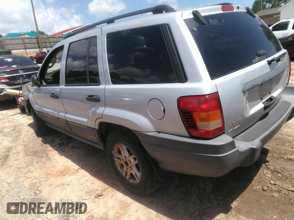 2004 Jeep Grand Cherokee Laredo z VIN 1J4GW48SX4C309998, wystawiony jako IAAI lot #42307167 z przebiegiem 306 912 mil mil oraz . Historia ofert i sprzedaży dostępna na DreamBid. Obrazek 3.