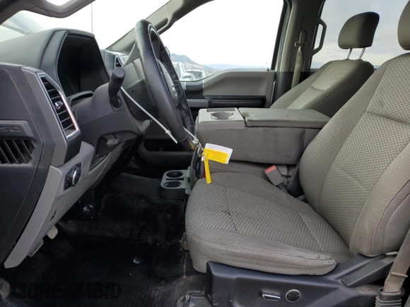 2015 Ford F-150 XLT with VIN 1FTEW1EG1FFA90068, listed as a Copart auction lot 84421594 with 150,386 mi miles and Salvage title. Bid and sale history available at DreamBid. Image 7.