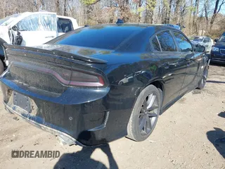 2019 Dodge Charger Scat Pack z VIN 2C3CDXGJ3KH740055, wystawiony jako IAAI lot #41736718 z przebiegiem 68 934 mil mil oraz . Historia ofert i sprzedaży dostępna na DreamBid. Obrazek 4.