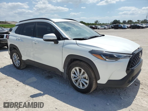 2024 Toyota Corolla Cross LE with VIN 7MUCAAAG7RV090677, listed as a Copart auction lot 57615565 with 6,910 mi miles and Salvage title. Bid and sale history available at DreamBid. Image 4.