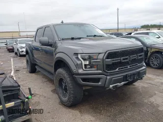 2020 Ford F-150 Raptor with VIN 1FTFW1RG0LFB66566, listed as a IAAI auction lot 41306076 with 92,596 mi miles and . Bid and sale history available at carsss.com. Image 1.