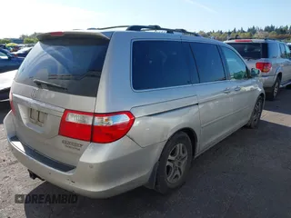 2005 Honda Odyssey TOURING with VIN 5FNRL38855B069043, listed as a IAAI auction lot 42035153 with 236,533 mi miles. Bid and sale history available at carsss.com. Image 6.