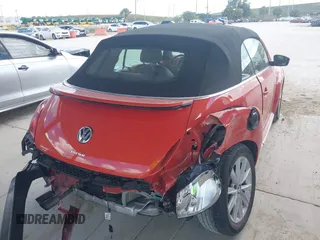 2018 Volkswagen Beetle S with VIN 3VW5DAAT3JM506460, listed as a IAAI auction lot 41556365 with 49,674 mi miles and . Bid and sale history available at DreamBid. Image 4.