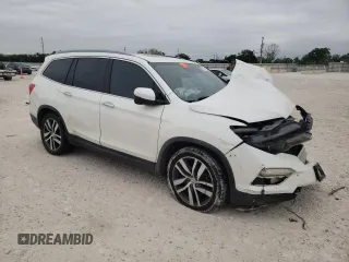 2017 Honda Pilot Touring with VIN 5FNYF5H95HB015365, listed as a Copart auction lot 52371205 with 153,141 mi miles and Salvage title. Bid and sale history available at DreamBid. Image 4.