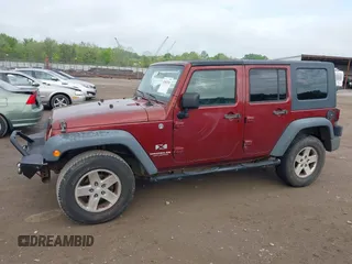 2008 Jeep Wrangler Unlimited X with VIN 1J4GA39108L606685, listed as a IAAI auction lot 41965538 with 288,946 mi miles. Bid and sale history available at carsss.com. Image 14.