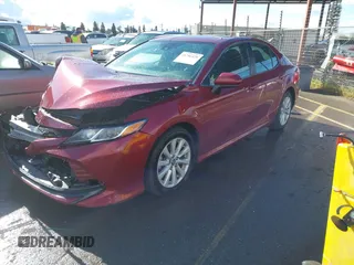 2020 Toyota Camry LE with VIN 4T1C11AK4LU916494, listed as a IAAI auction lot 41786429 with 100,032 mi miles and . Bid and sale history available at DreamBid. Image 2.