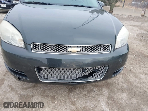2014 Chevrolet Impala LS with VIN 2G1WA5E30E1125611, listed as a IAAI auction lot 41828292 with 141,826 mi miles and . Bid and sale history available at DreamBid. Image 6.