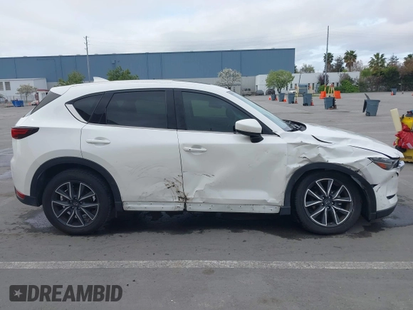 2018 Mazda CX-5 Grand Touring with VIN JM3KFADM1J0309995, listed as a IAAI auction lot 41977003 with 75,303 mi miles. Bid and sale history available at carsss.com. Image 14.