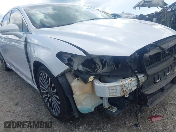 2017 Ford Fusion Titanium z VIN 3FA6P0K93HR203063, wystawiony jako IAAI lot #42243064 z przebiegiem 176 078 mil mil oraz . Historia ofert i sprzedaży dostępna na DreamBid. Obrazek 6.
