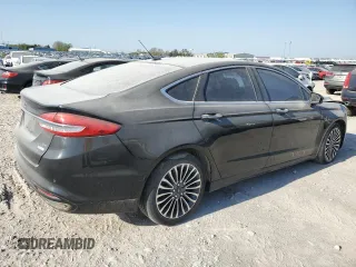 2017 Ford Fusion SE z VIN 3FA6P0H98HR179253, wystawiony jako Copart lot #52015345 z przebiegiem 99 883 mil mil oraz Czysty tytuł • Clean title. Historia ofert i sprzedaży dostępna na DreamBid. Obrazek 3.