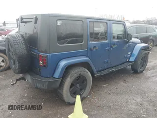 2010 Jeep Wrangler Unlimited Sahara with VIN 1J4BA5H17AL166915, listed as a IAAI auction lot 41561508 with 252,337 mi miles. Bid and sale history available at carsss.com. Image 4.