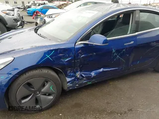 2020 Tesla Model 3 Standard Range Plus with VIN 5YJ3E1EAXLF644679, listed as a IAAI auction lot 41500595 with 53,726 mi miles and . Bid and sale history available at DreamBid. Image 6.