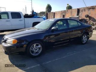 2002 Pontiac Grand Am GT with VIN 1G2NW52E12M704539, listed as a Copart auction lot 73755214 with 100,904 mi miles and Clean Title. Bid and sale history available at carsss.com. Image 1.
