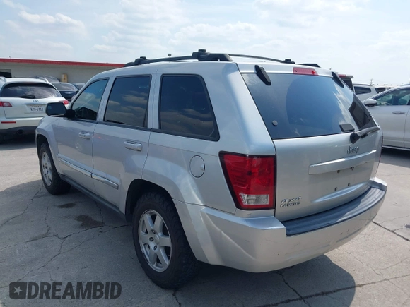 2010 Jeep Grand Cherokee Laredo with VIN 1J4PR4GK1AC143780, listed as a IAAI auction lot 42058575 with 88,608 mi miles. Bid and sale history available at carsss.com. Image 3.