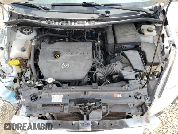 2012 Mazda 5 Touring z VIN JM1CW2CL0C0123721, wystawiony jako Copart lot #52415065 z przebiegiem 168 659 mil mil oraz Szkoda całkowita • Salvage title. Historia ofert i sprzedaży dostępna na DreamBid. Obrazek 12.
