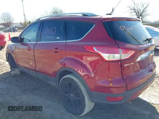 2016 Ford Escape Titanium with VIN 1FMCU9J98GUB42453, listed as a IAAI auction lot 41760110 with 116,452 mi miles. Bid and sale history available at carsss.com. Image 3.