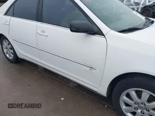 2003 Toyota Camry LE z VIN JTDBF30K530148403, wystawiony jako IAAI lot #41688346 z przebiegiem 299 143 mil mil oraz . Historia ofert i sprzedaży dostępna na DreamBid. Obrazek 19.