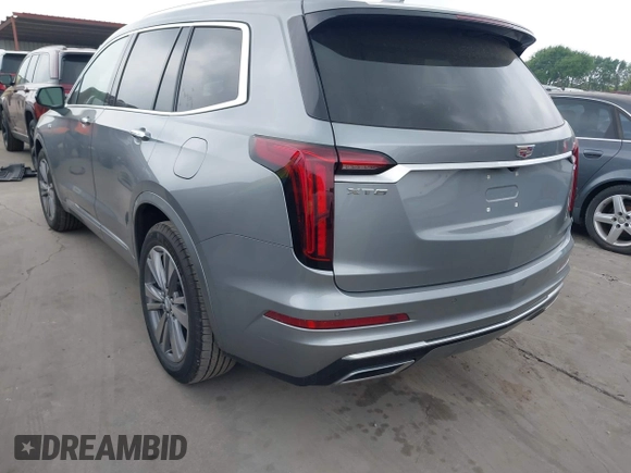 2025 Cadillac XT6 FWD Premium Luxury with VIN 1GYKPCRS4SZ119978, listed as a IAAI auction lot 41877109 with 13,579 mi miles. Bid and sale history available at carsss.com. Image 3.