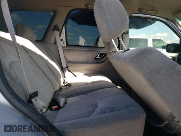 2002 Mazda Tribute LX with VIN 4F2YU09182KM64860, listed as a Copart auction lot 77391824 with 207,965 mi miles and Salvage Title. Bid and sale history available at DreamBid. Image 11.