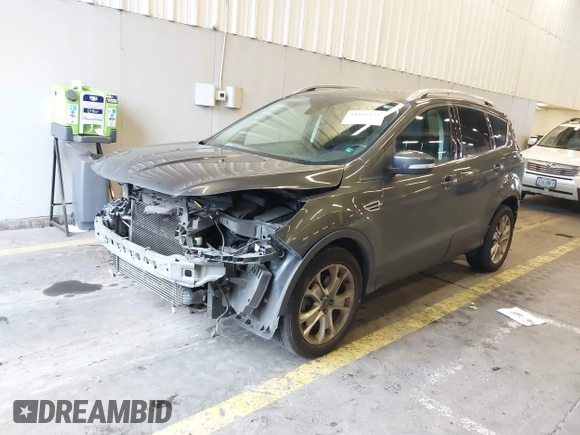 2016 Ford Escape Titanium with VIN 1FMCU9J92GUB63525, listed as a IAAI auction lot 41469824 with 156,773 mi miles. Bid and sale history available at carsss.com. Image 2.