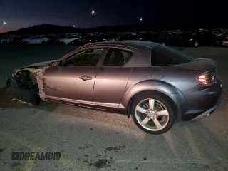 2005 Mazda RX-8 with VIN JM1FE17N950157715, listed as a Copart auction lot 76077944 with 102,174 mi miles and Salvage Title. Bid and sale history available at carsss.com. Image 2.