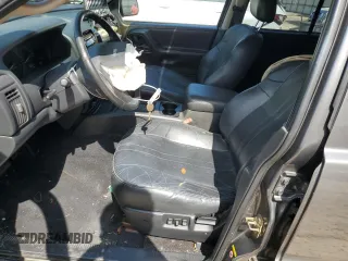 2002 Jeep Grand Cherokee with VIN 1J8GX48S12C255290, listed as a Copart auction lot 57832025 with 191,293 mi miles and Non repairable. Bid and sale history available at DreamBid. Image 7.