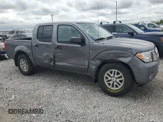 2019 Nissan Frontier SV with VIN 1N6AD0EV9KN701104, listed as a Copart auction lot 56704705 with 76,882 mi miles and Salvage title. Bid and sale history available at DreamBid. Image 4.