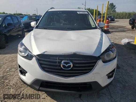 2016 Mazda CX-5 Touring z VIN JM3KE2CYXG0683673, wystawiony jako Copart lot #56724025 z przebiegiem 107 293 mil mil oraz Szkoda całkowita • Salvage title. Historia ofert i sprzedaży dostępna na DreamBid. Obrazek 5.