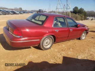 1998 Ford Crown Victoria LX с VIN 2FAFP74W3WX138757, выставлен на аукционе Copart как лот 87867945 с пробегом 148 827 миль миль и Списание • Salvage title. История ставок и продаж доступна на DreamBid. Изображение 3.
