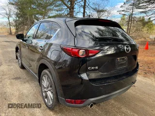 2020 Mazda CX-5 Grand Touring with VIN JM3KFADM8L0785373, listed as a Copart auction lot 50829175 with 135,736 mi miles and Clean Title. Bid and sale history available at DreamBid. Image 3.