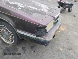 1992 Dodge Dynasty LE z VIN 1B3XC56R0ND750136, wystawiony jako IAAI lot #41955511 z przebiegiem 144 248 mil mil oraz . Historia ofert i sprzedaży dostępna na DreamBid. Obrazek 13.