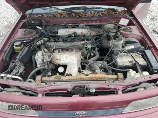 1991 Toyota Camry DLX z VIN 4T1SV21E0MU450578, wystawiony jako Copart lot #73990024 z przebiegiem 149 342 mil mil oraz Czysty tytuł • Clean title. Historia ofert i sprzedaży dostępna na DreamBid. Obrazek 11.