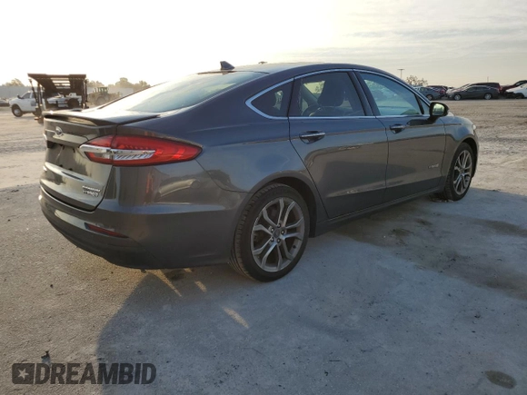 2019 Ford Fusion Hybrid Titanium with VIN 3FA6P0RU9KR116785, listed as a Copart auction lot 68052202 with 89,486 mi miles. Bid and sale history available at carsss.com. Image 3.