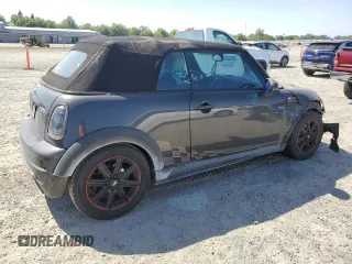 2011 MINI Convertible S с VIN WMWZP3C59BT249133, выставлен на аукционе Copart как лот 56402615 с пробегом 103 809 миль миль и Списание • Salvage title. История ставок и продаж доступна на DreamBid. Изображение 3.