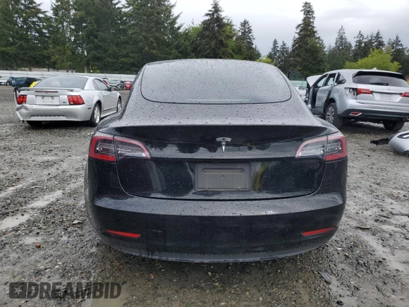 2023 Tesla Model 3 with VIN 5YJ3E1EA2PF457667, listed as a Copart auction lot 57360035 with 53,962 mi miles and Salvage title. Bid and sale history available at DreamBid. Image 6.