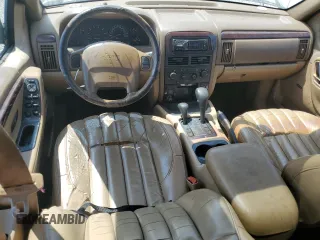 2000 Jeep Grand Cherokee Limited z VIN 1J4GW58N0YC272532, wystawiony jako Copart lot #57524225 z przebiegiem 238 921 mil mil oraz Szkoda całkowita • Salvage title. Historia ofert i sprzedaży dostępna na DreamBid. Obrazek 8.