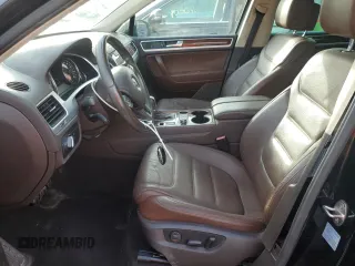 2012 Volkswagen Touareg Exec with VIN WVGEF9BP1CD011407, listed as a Copart auction lot 79199754 with 57,376 mi miles and Salvage Title. Bid and sale history available at DreamBid. Image 7.