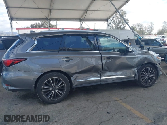 2019 Infiniti QX60 Pure z VIN 5N1DL0MN3KC565998, wystawiony jako IAAI lot #41911130 z przebiegiem 79 463 mil mil oraz . Historia ofert i sprzedaży dostępna na DreamBid. Obrazek 13.