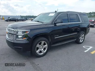 2015 Chevrolet Tahoe LT with VIN 1GNSCBKC4FR145119, listed as a IAAI auction lot 42309931 with 99,408 mi miles and . Bid and sale history available at DreamBid. Image 2.