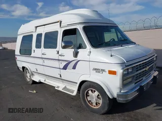 1995 Chevrolet Chevy Van z VIN 1GBEG25K5SF131291, wystawiony jako IAAI lot #41861888 z przebiegiem 90 365 mil mil oraz . Historia ofert i sprzedaży dostępna na DreamBid. Obrazek 6.