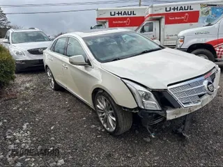 2013 Cadillac XTS Platinum with VIN 2G61V5S33D9173441, listed as a IAAI auction lot 41902672 with 103,044 mi miles. Bid and sale history available at carsss.com. Image 1.