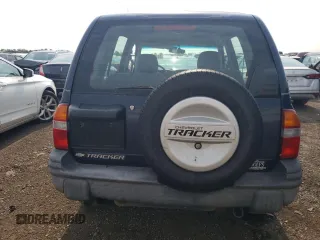 2001 Chevrolet Tracker z VIN 2CNBJ13C616955326, wystawiony jako Copart lot #64105184 z przebiegiem 138 156 mil mil oraz Tytuł czysty. Historia ofert i sprzedaży dostępna na DreamBid. Obrazek 6.