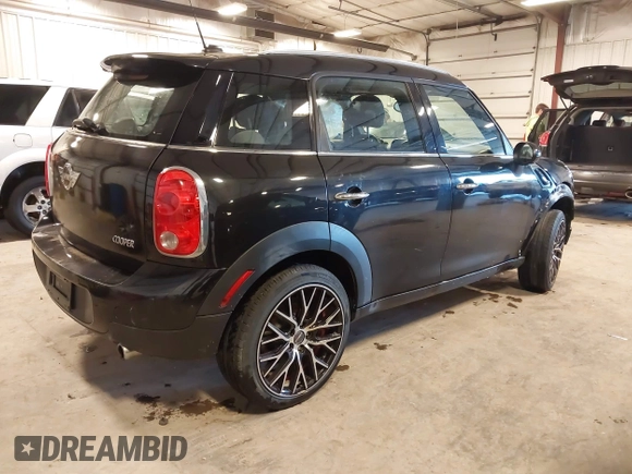2012 MINI Countryman with VIN WMWZB3C53CWM05133, listed as a IAAI auction lot 41493309 with 114,412 mi miles and . Bid and sale history available at DreamBid. Image 4.
