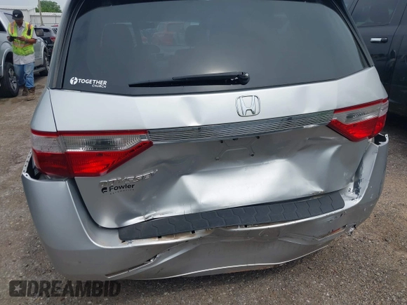 2012 Honda Odyssey EX-L with VIN 5FNRL5H66CB081323, listed as a IAAI auction lot 42465110 with 266,934 mi miles and . Bid and sale history available at DreamBid. Image 6.