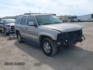 2003 Chevrolet Tahoe LS z VIN 1GNEK13T43J153854, wystawiony jako IAAI lot #41755537 z przebiegiem Nie podano mil oraz . Historia ofert i sprzedaży dostępna na DreamBid. Obrazek 1.