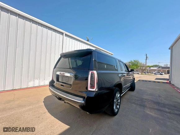 2015 GMC Yukon XL Denali with VIN 1GKS2JKJ5FR282675, listed as a Copart auction lot 52463365 with 221,109 mi miles and Clean Title. Bid and sale history available at carsss.com. Image 4.